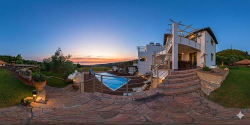 a house with a boat on the side of it at Villa Freebird - VIP Wedding & Bachelor Events in Pefkochori