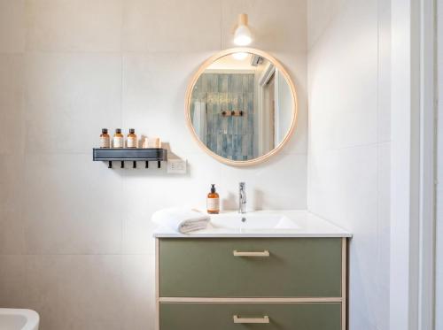 a bathroom with a sink and a mirror at Andromeda in Modugno