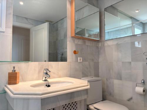 a bathroom with a sink and a toilet at Life Apartments Costa Ballena in Costa Ballena