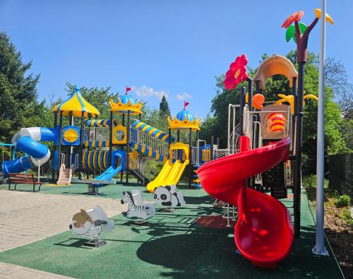 a playground with a slide in a park at Black Forest Hotel Kappel-Grafenhausen in Kappel-Grafenhausen
