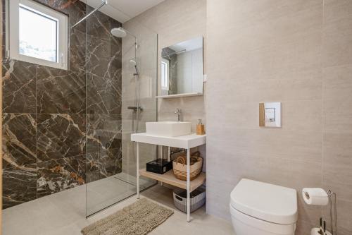 a bathroom with a toilet and a sink and a shower at Adriatic Sea Escape B20 in Herceg-Novi