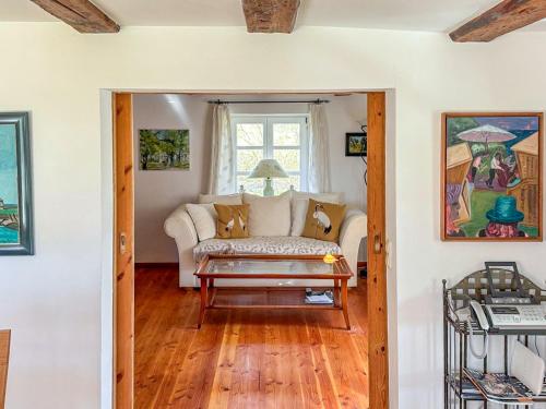 a living room with a couch and a table at Landhaus Rubitz in Rubitz