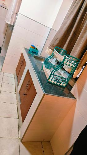 a kitchen with a sink and a counter top at Shima Complex in Nakuru