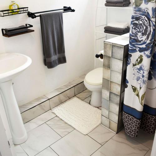 a bathroom with a toilet and a sink at Blue Sky Apartment in Soufrière