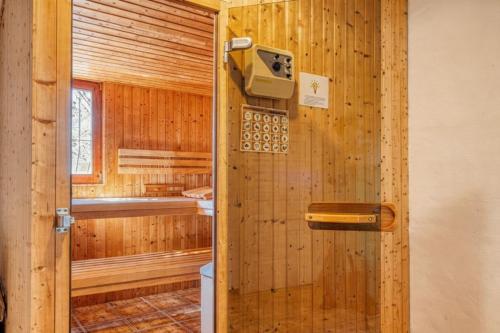 a wooden bathroom with a toilet and a sink at Robis Moraira in Benissa