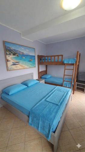 a bedroom with two bunk beds in a room at Sea & Sky apartment in Skataj