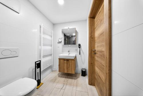a bathroom with a white toilet and a sink at Schinagl Klaus in Klaus an der Pyhrnbahn