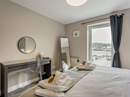 a room with a bed with towels on it at 1 Bed in Oban oc-96079 in Oban