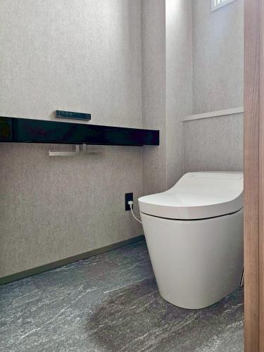 a bathroom with a white toilet in a room at Hope Private Villa tateyama in Tateyama