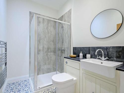 a bathroom with a shower and a toilet and a sink at 2 Bed in Hawick oc-86021 in Hawick