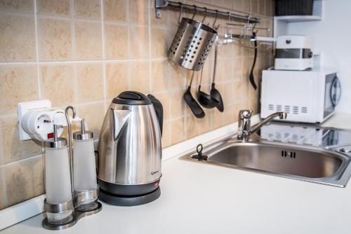 Kuchyň nebo kuchyňský kout v ubytování Apartment Roko