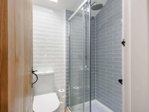 a bathroom with a toilet and a glass shower at 2 Bed in Ormskirk oc-90263 in Barton