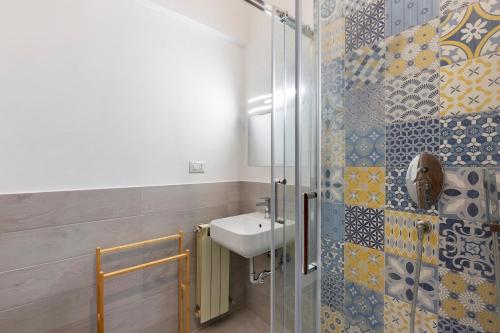 a bathroom with a sink and a shower at Casa Vacanze Bouganvillea in Sabaudia