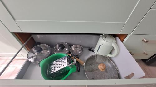 a drawer with some utensils in a kitchen at Monte Ricco Appartamenti in Monselice