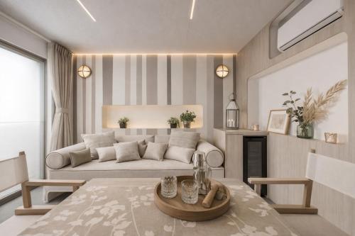 a living room with a couch and a table at Delta Open Air Resort in Porto Garibaldi