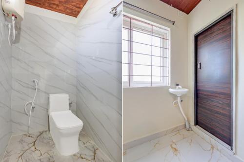a bathroom with a toilet and a sink at Srinivasa Hotel in Narasingāpuram