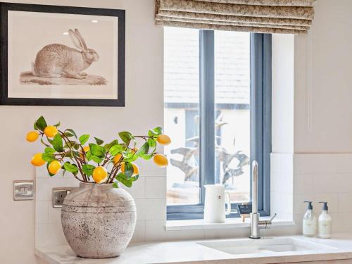 a bathroom sink with a vase with a rabbit on it at 2 Bed in Brampton oc-91822 in Brampton