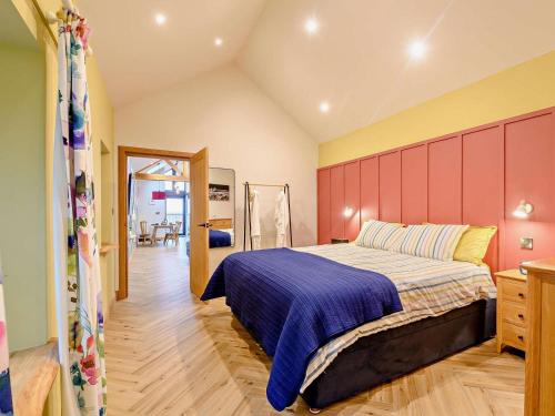a bedroom with a large bed in a room at 1 Bed in Lockerbie oc-93110 in Lockerbie