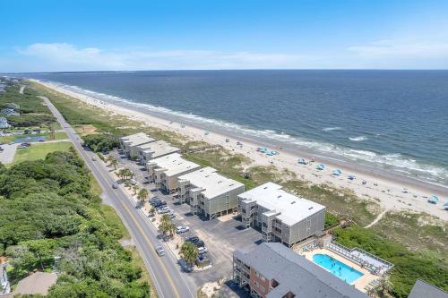an aerial view of a beach with buildings and the ocean at Beach Therapy by Oak Island Accommodations in Caswell Beach