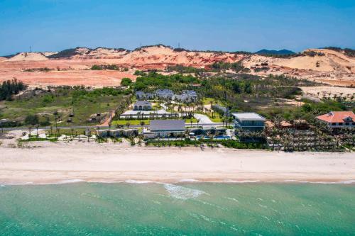 an aerial view of a resort on the beach at Polaris Resort & Spa in Xóm Tram