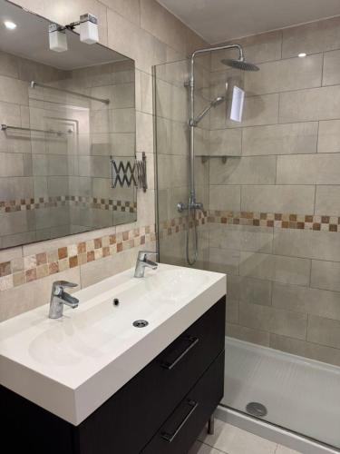 a bathroom with a sink and a shower at Volver in Mijas Costa