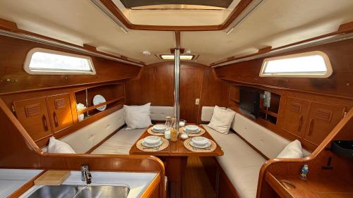 a dining table in the center of a boat at Velero Nadya in Arrecife