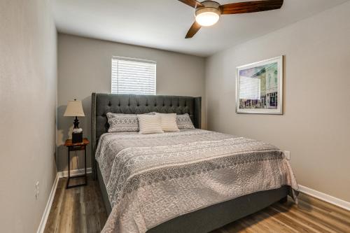 a bedroom with a bed and a ceiling fan at Tiger Town Retreat: Spacious 3-Home Retreat! in Baton Rouge