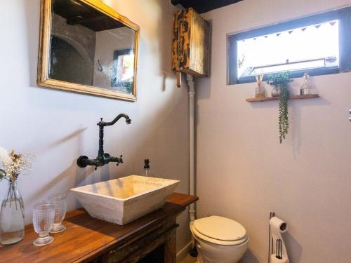 a bathroom with a sink and a toilet at casa montepio in San Antonio de Areco