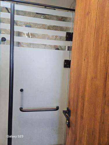 a door in a room with a wooden door gmaxwell gmaxwell gmaxwell at Sheraton Royal Sea View in Alexandria