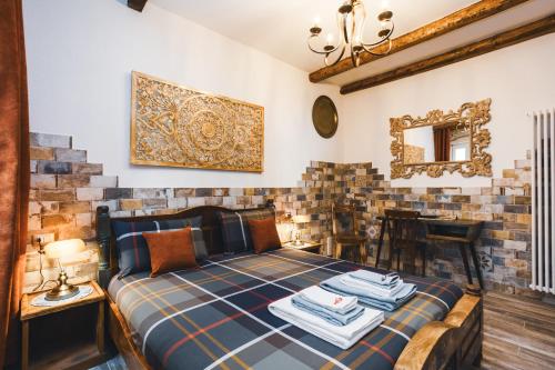 a bedroom with a king sized bed in a room with tiles at AQUILA D'ORO TRIESTE in Trieste