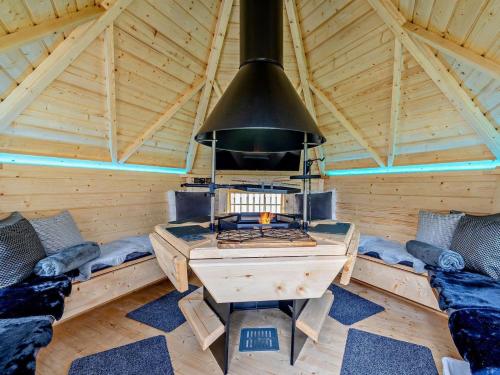 a room with a stove in a wooden cabin at 3 Bed in Carlisle oc-94673 in Longtown
