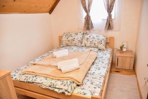 a small bedroom with a bed in a room at Villa Boris in Junčev Do