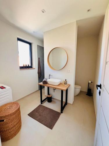 a bathroom with a sink and a mirror at Vila Esnella - Private Pool & Panoramic Sea view in Primošten