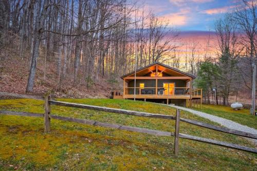 a house on a hill with a fence at Lane's End in Laurelville