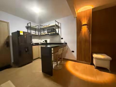 a kitchen with a counter and a sink in a room at LoftBrothers39 in Bucaramanga