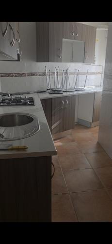 a kitchen with a stove and a counter top at Casa Villa Zarcillo in Torreorgaz