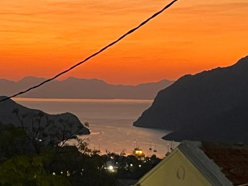 a view of the amalfi coast at sunset at Aleminas Rooms 2 in Symi