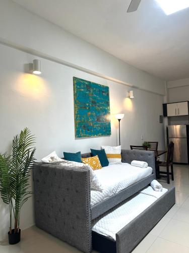 a living room with a couch and a table at La Estadia in San Juan