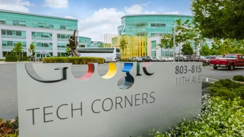 a sign in front of a tech companies building at Grand Hotel in Sunnyvale