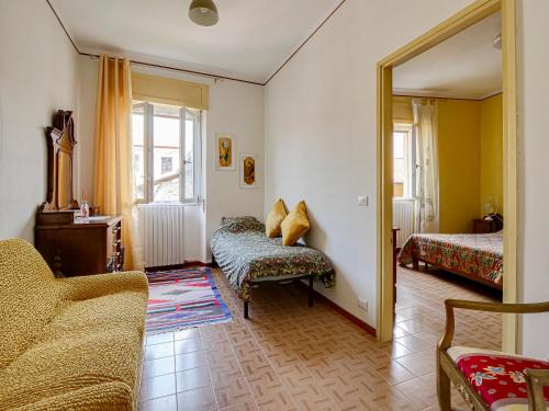 a living room with a chair and a mirror at IL TORRINO in Golasecca