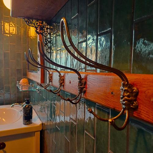 a hook on the wall of a bathroom with a sink at Villagatan in Hjo