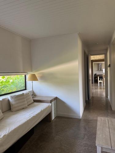 a living room with a couch and a table at CASA HORTENSIAS in Quequén