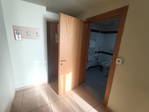 an open door to a bathroom with a toilet at Hotel Panorama in Cambiano
