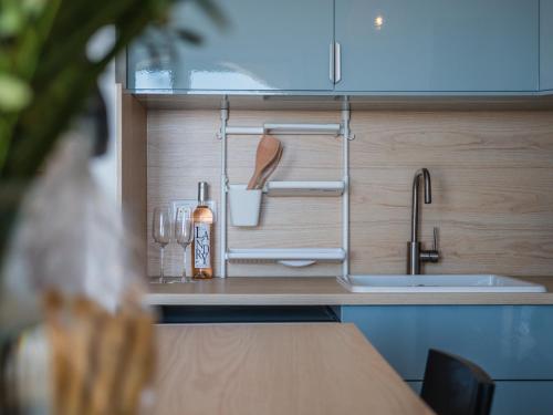 a kitchen counter top with a sink and a sink at Résidences Sopramare in Algajola