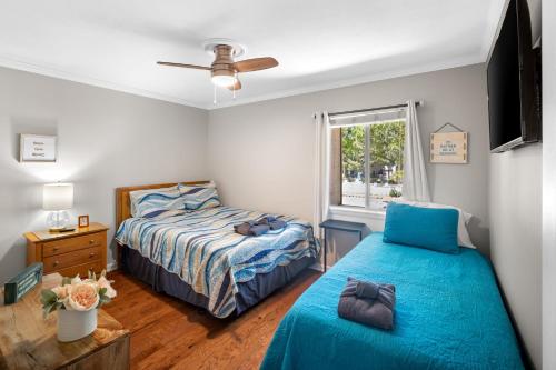 a bedroom with two beds and a window at 5 MIN WALK TO BEACH- 2BR1BA Villa in The Dunes in Hilton Head Island