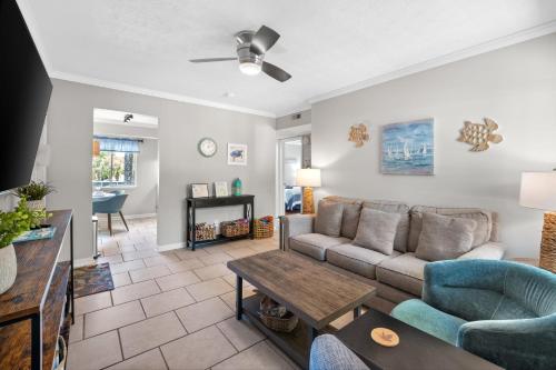 a living room with a couch and a table at 5 MIN WALK TO BEACH- 2BR1BA Villa in The Dunes in Hilton Head Island