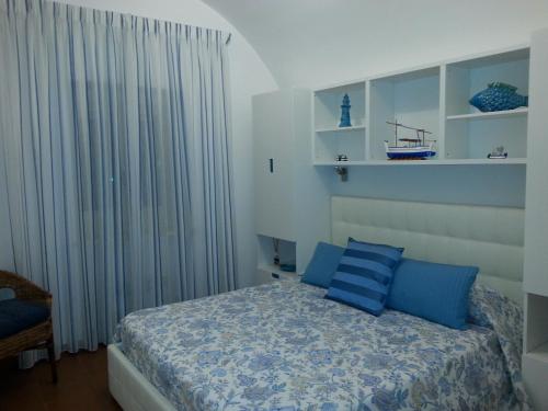 Säng eller sängar i ett rum på Casa Vacanze Bouganvillea