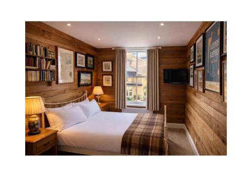 a bedroom with a bed and a window at The Royal Harbour Hotel in Ramsgate