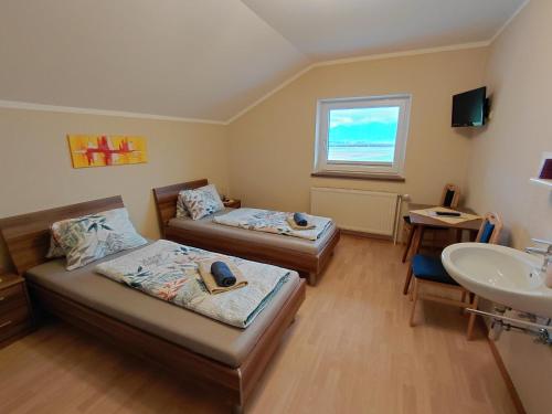 a hospital room with two beds and a sink at Haus Staubmann Nähe Red Bull Ring Spielberg in Rattenberg