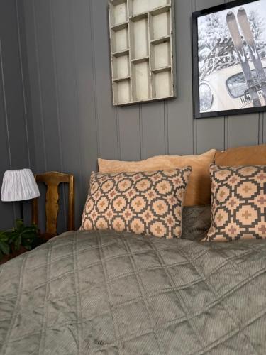 a bedroom with a bed and a mirror on the wall at Mountain apartment in Vaga